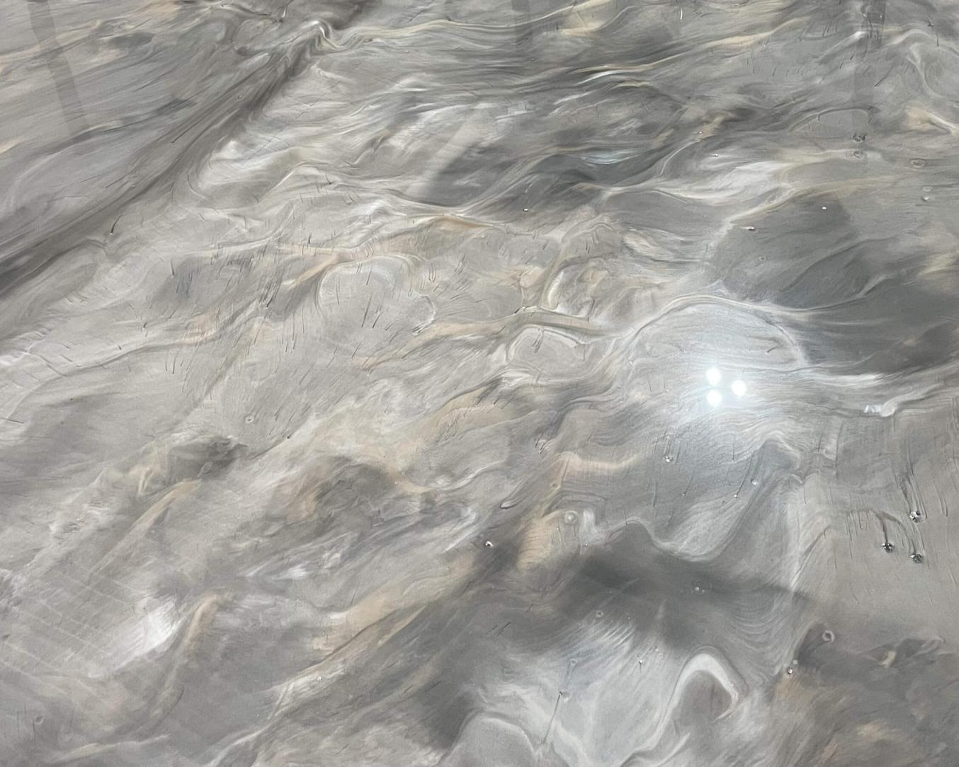 Silver swirl metallic epoxy closeup